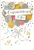 The photograph shows an elegant congratulations card whose design feels like a captured moment from a stylish Gidea Park celebration. A lush bouquet of illustrated balloons dominates the front, their rounded forms overlapping in a playful cluster that suggests depth, like a handful of real balloons bobbing at a garden party near Lodge Avenue. Each balloon has its own personality: some in rich gold, others in cool silver, champagne beige, sky blue, soft pink and gentle grey, with delicate glitter, star motifs or slim stripes giving them a festive shimmer. Fine ribbons, drawn in metallic gold and silver, twist and dance downward from the balloons, their looping lines meeting in a single, unseen gathering point that seems to anchor the composition. Around the bouquet, tiny stars, confetti dots and sweeping curls echo the movement of air and music, as if someone has just shouted well done and tossed streamers into the sky. A wide banner floats across the centre of the design, lightly resting on the balloons and displaying the message Congratulations To You in poised, flowing calligraphy. The pale background allows every metallic accent to glow softly, much like party lights reflecting off glassware at an evening celebration. The overall impression is one of joyful sophistication and heartfelt pride, the kind of card you might slip next to a hand-tied arrangement, using paper, ink and a touch of sparkle to say that this achievement truly matters and will be remembered.